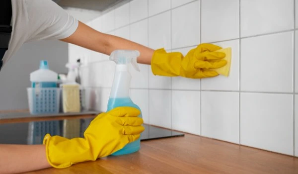 Side view woman cleaning home