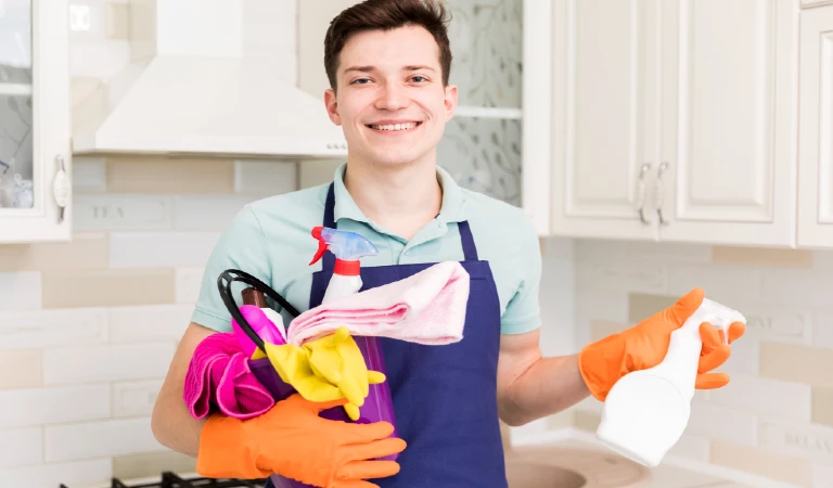 Portrait of man cleaning house