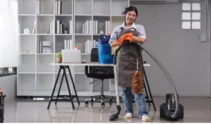 Cleaning in the room lady uses a mop and a vacuum cleaner to clean the floor