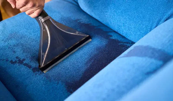 The professional upholstery cleaning process is in full action showcasing its effectiveness