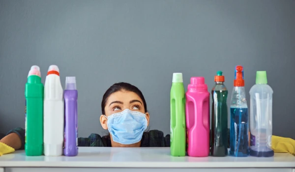 Woman face mask and detergent for cleaning