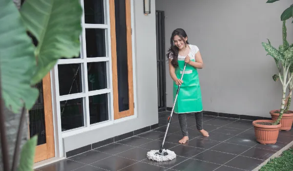 Woman cleaning up her house