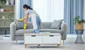 It looks good now shot of a young woman cleaning at home