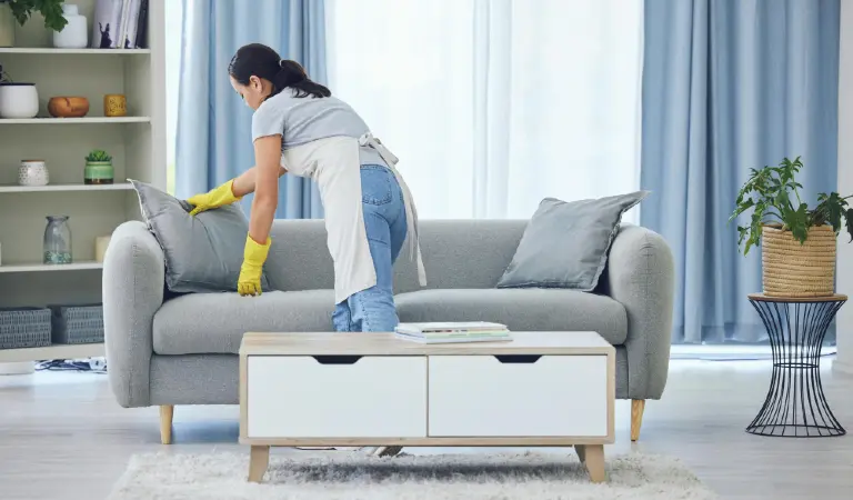 It looks good now shot of a young woman cleaning at home